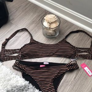 Black and rose gold striped bikini. Tags on